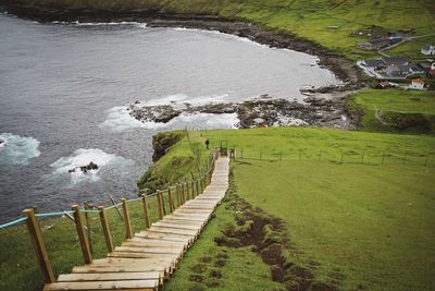 High angle view of footpath by sea