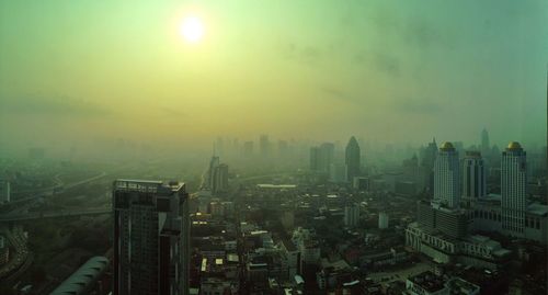 Aerial view of cityscape against sky