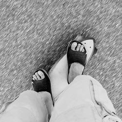 Low section of woman standing on tiled floor