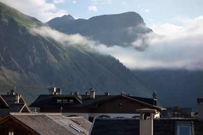 High angle view of townscape and mountains against sky