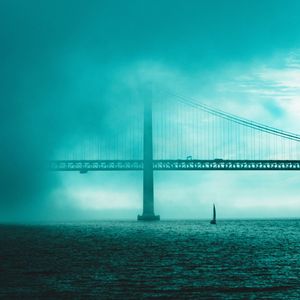 Bridge over sea against sky