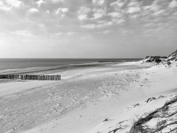 Scenic view of beach against sky