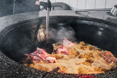 Cropped hand of person preparing food