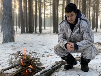 Full length of a young man in the forest