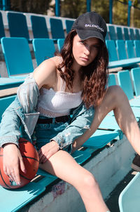 Portrait of young woman playing guitar