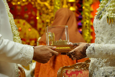 Midsection of woman holding drink