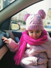 Full length of woman in car