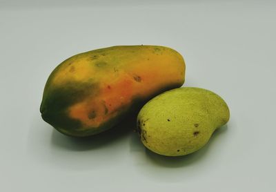 Close-up of fruits against white background
