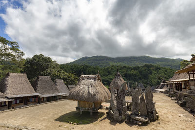 Panoramic view of old building in village against sky