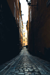 Narrow alley amidst buildings in city