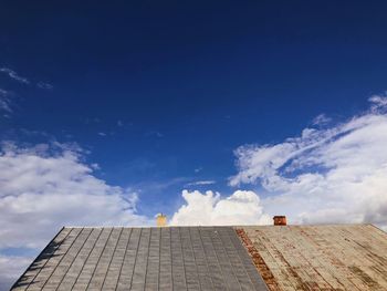 Low angle view of building against blue sky