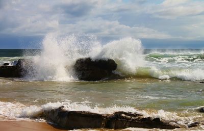 Waves splashing on rocks