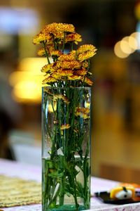 Close-up of yellow flower on table