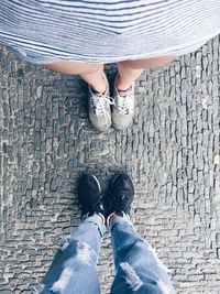 Low section of woman standing on ground