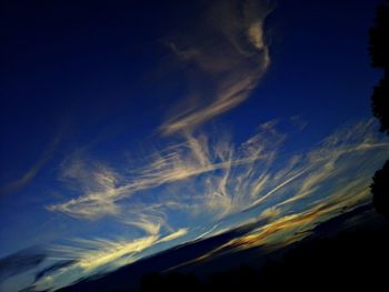 Scenic view of landscape against sky at sunset