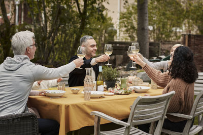 Friends having meal in garden