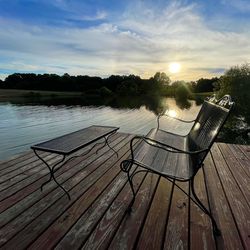 Scenic view of lake against sky during sunset