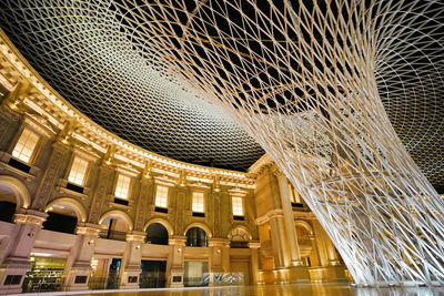 Low angle view of illuminated building in city
