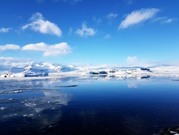 Scenic view of frozen lake against sky