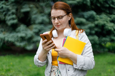 Young woman using mobile phone