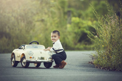 Boy toy car on road
