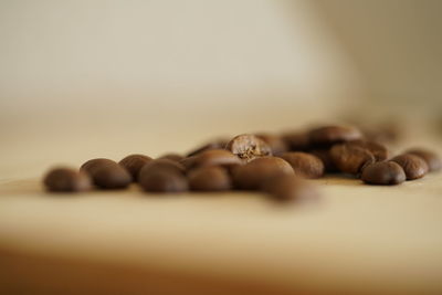 Close-up of coffee beans on table