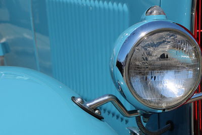 Close-up of a blue vintage car