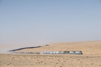 Scenic view of desert against clear sky