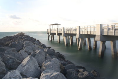 Pier over sea against sky