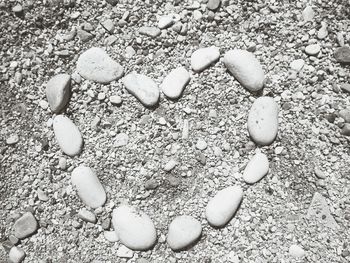 Close-up of pebbles on sand