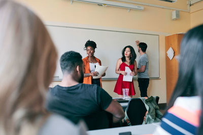 Multi-ethnic teachers teaching students in language school