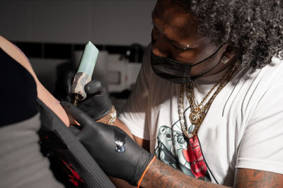 Rear view of man using mobile phone