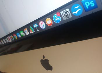 Low angle view of illuminated text on wall