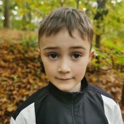 Portrait of boy standing outdoors