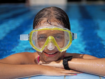 Portrait of man swimming in pool