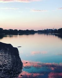 Scenic view of lake against sky during sunset