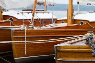 Wooden boats moored in river