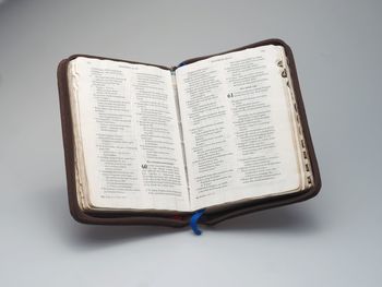 Close-up of open book against white background
