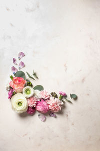 High angle view of rose bouquet on white table
