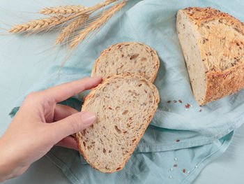 Cropped hand of person holding bread