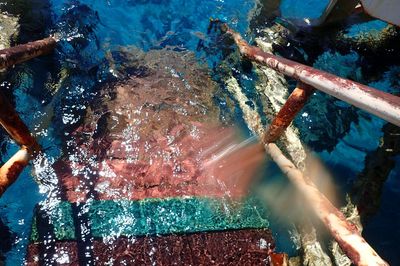 High angle view of abandoned steps in sea