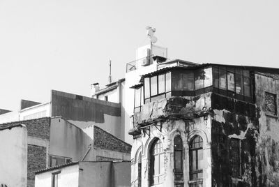 Low angle view of old building against clear sky