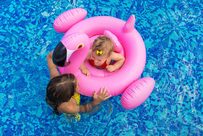 High angle view of woman swimming in pool