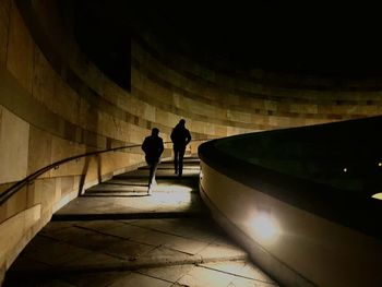 Silhouette people on floor at night