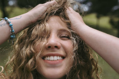 Close-up portrait of a smiling young woman