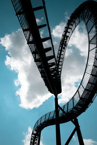 Low angle view of silhouette bridge against sky