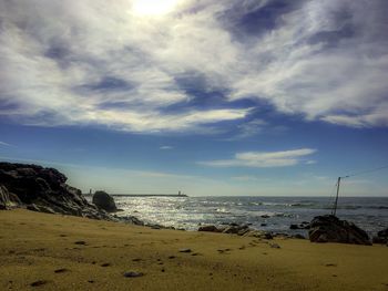 Scenic view of beach against sky