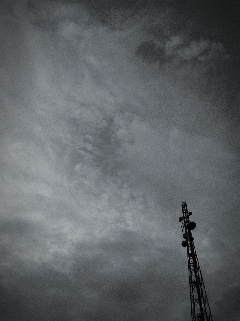 low angle view, sky, cloud - sky, electricity, technology, cloudy, silhouette, dusk, weather, electricity pylon, fuel and power generation, connection, tall - high, nature, no people, built structure, outdoors, overcast, power supply, power line