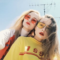 Portrait of women in sunglasses against sky