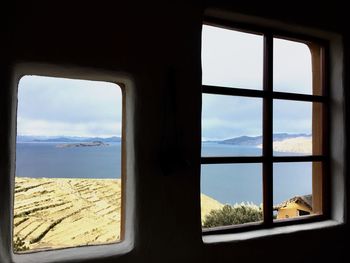 Scenic view of sea seen through window